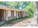 Charming home featuring a brick facade, red shutters, and a covered carport entry at 2668 Kings Way, Lawrenceville, GA 30044