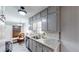 Bright kitchen with granite countertops, stainless steel sink, and ample cabinet space at 2668 Kings Way, Lawrenceville, GA 30044