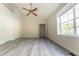 Bright bedroom featuring a vaulted ceiling, large windows, and a ceiling fan at 3474 Washington Way, Atlanta, GA 30340