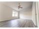 Spacious bedroom featuring a ceiling fan, large window, and modern flooring at 3474 Washington Way, Atlanta, GA 30340