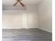 Bright bedroom featuring modern flooring, vaulted ceiling, and closet doors at 3474 Washington Way, Atlanta, GA 30340