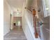Inviting entryway showcasing modern flooring, staircase, and natural light streaming through the front door at 3474 Washington Way, Atlanta, GA 30340