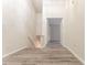 Well-lit hallway featuring modern gray wood flooring and fresh paint at 3474 Washington Way, Atlanta, GA 30340