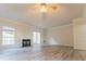 Spacious living room with fireplace, ceiling fan and sliding glass doors creating a relaxing atmosphere at 3474 Washington Way, Atlanta, GA 30340