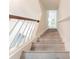 Inviting staircase with wood railing and gray wood-look steps at 3474 Washington Way, Atlanta, GA 30340