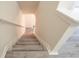 Staircase featuring modern gray flooring and white trim at 3474 Washington Way, Atlanta, GA 30340