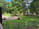 Spacious backyard featuring a patio, fire pit, and ample greenery, perfect for outdoor entertaining and relaxation at 3594 Saddlebrook Dr, Loganville, GA 30052