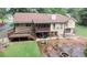Spacious backyard with a deck, patio, fire pit, and lush green lawn perfect for outdoor entertaining at 3594 Saddlebrook Dr, Loganville, GA 30052