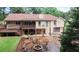 Expansive backyard featuring a deck, patio with fire pit, and ample space for outdoor activities at 3594 Saddlebrook Dr, Loganville, GA 30052