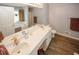 Stylish bathroom offering double sinks, a jetted tub, and modern fixtures at 3594 Saddlebrook Dr, Loganville, GA 30052