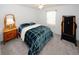 Inviting bedroom with a comfortable bed, soft carpet, and ample space at 3594 Saddlebrook Dr, Loganville, GA 30052