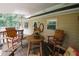 Charming covered deck featuring rustic wooden furniture with view of the backyard at 3594 Saddlebrook Dr, Loganville, GA 30052