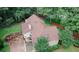 Aerial view of the home, surrounded by mature trees at 3594 Saddlebrook Dr, Loganville, GA 30052