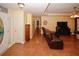 Inviting living room with hardwood floors, ceiling fan, and a leather sectional sofa at 3594 Saddlebrook Dr, Loganville, GA 30052