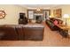 Warm living room with hardwood floors, fireplace, and comfortable leather furniture at 3594 Saddlebrook Dr, Loganville, GA 30052