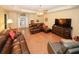 Sun-drenched living room boasts hardwood floors and tray ceilings at 3594 Saddlebrook Dr, Loganville, GA 30052
