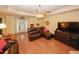 Bright living room featuring hardwood floors and tray ceilings at 3594 Saddlebrook Dr, Loganville, GA 30052