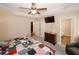 Serene main bedroom featuring a TV, walk-in closet, and an ensuite bathroom at 3594 Saddlebrook Dr, Loganville, GA 30052