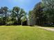 Image of a durable and spacious outbuilding with ample yard space and easy access, ideal for storage at 3594 Saddlebrook Dr, Loganville, GA 30052