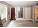 Bright sitting area with tile floors and multiple windows at 3594 Saddlebrook Dr, Loganville, GA 30052