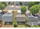 Aerial view of the property showing the roof, surrounding trees, and neighborhood at 3610 Darcy Nw Ct, Kennesaw, GA 30144
