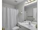 Contemporary bathroom with geometric wallpaper, shower-tub combination, and modern fixtures at 3610 Darcy Nw Ct, Kennesaw, GA 30144