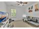 Spacious bedroom with modern decor, ceiling fan, and window for natural light at 3610 Darcy Nw Ct, Kennesaw, GA 30144