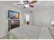 Bedroom featuring neutral decor, ceiling fan, and doorway to hallway at 3610 Darcy Nw Ct, Kennesaw, GA 30144