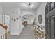Open-concept foyer with arched doorway leading into a living room with fireplace at 3610 Darcy Nw Ct, Kennesaw, GA 30144