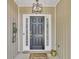 Front door area with wood paneled walls and a contemporary light fixture at 3610 Darcy Nw Ct, Kennesaw, GA 30144