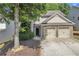 Charming two-story home with a two-car garage and a beautifully landscaped front yard at 3610 Darcy Nw Ct, Kennesaw, GA 30144