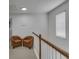 Upstairs hallway featuring modern railings, natural lighting, and reading nooks at 3610 Darcy Nw Ct, Kennesaw, GA 30144