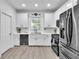 Bright kitchen features stainless appliances, gas range, and white cabinetry at 3610 Darcy Nw Ct, Kennesaw, GA 30144