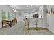 Open concept kitchen with stainless appliances, breakfast bar, and dining area with modern light fixture at 3610 Darcy Nw Ct, Kennesaw, GA 30144