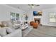 Bright living room features fireplace, modern lighting, large windows, and elegant furnishings at 3610 Darcy Nw Ct, Kennesaw, GA 30144
