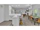 Open concept kitchen with stainless appliances, breakfast bar, dining area, and fireplace at 3610 Darcy Nw Ct, Kennesaw, GA 30144