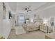 Light-filled main bedroom featuring tray ceilings, a ceiling fan, and neutral accents at 3610 Darcy Nw Ct, Kennesaw, GA 30144