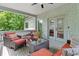Cozy covered back porch features wicker furniture, a ceiling fan, and access to outdoor views at 805 Ponce De Leon Ne Ter, Atlanta, GA 30306