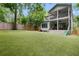 Expansive backyard featuring a putting green, covered patio, and lush landscaping, great for outdoor activities at 805 Ponce De Leon Ne Ter, Atlanta, GA 30306