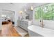 Luxurious bathroom with soaking tub, dual vanity, and access to the bedroom at 805 Ponce De Leon Ne Ter, Atlanta, GA 30306