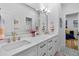 Modern bathroom featuring a double vanity with quartz countertops, stylish fixtures, and an adjacent bedroom at 805 Ponce De Leon Ne Ter, Atlanta, GA 30306