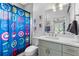 ' bathroom featuring vanity with a framed mirror, and an avengers shower curtain at 805 Ponce De Leon Ne Ter, Atlanta, GA 30306