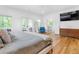 Airy bedroom with natural light, balcony access, and a view into the en suite bathroom at 805 Ponce De Leon Ne Ter, Atlanta, GA 30306