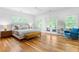 Spacious bedroom with hardwood floors, large windows, and access to a private balcony at 805 Ponce De Leon Ne Ter, Atlanta, GA 30306