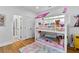 Adorable ' bedroom featuring charming bunk beds with pink awning and a colorful rug at 805 Ponce De Leon Ne Ter, Atlanta, GA 30306