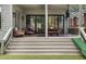 Inviting covered patio with comfortable seating and dining area, perfect for outdoor relaxation and entertaining at 805 Ponce De Leon Ne Ter, Atlanta, GA 30306