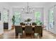 Bright dining room featuring a modern chandelier, hardwood floors, and large windows offering scenic views at 805 Ponce De Leon Ne Ter, Atlanta, GA 30306