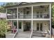 Inviting porch showcasing outdoor seating, classic lighting, and views from the home's double balconies at 805 Ponce De Leon Ne Ter, Atlanta, GA 30306
