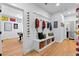 Mudroom area featuring a built-in bench, hooks, and storage baskets, with access to a pool table at 805 Ponce De Leon Ne Ter, Atlanta, GA 30306