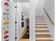 Hallway featuring a staircase and a display of sports memorabilia on the wall at 805 Ponce De Leon Ne Ter, Atlanta, GA 30306